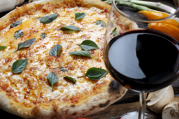 Pizza with glass of red wine