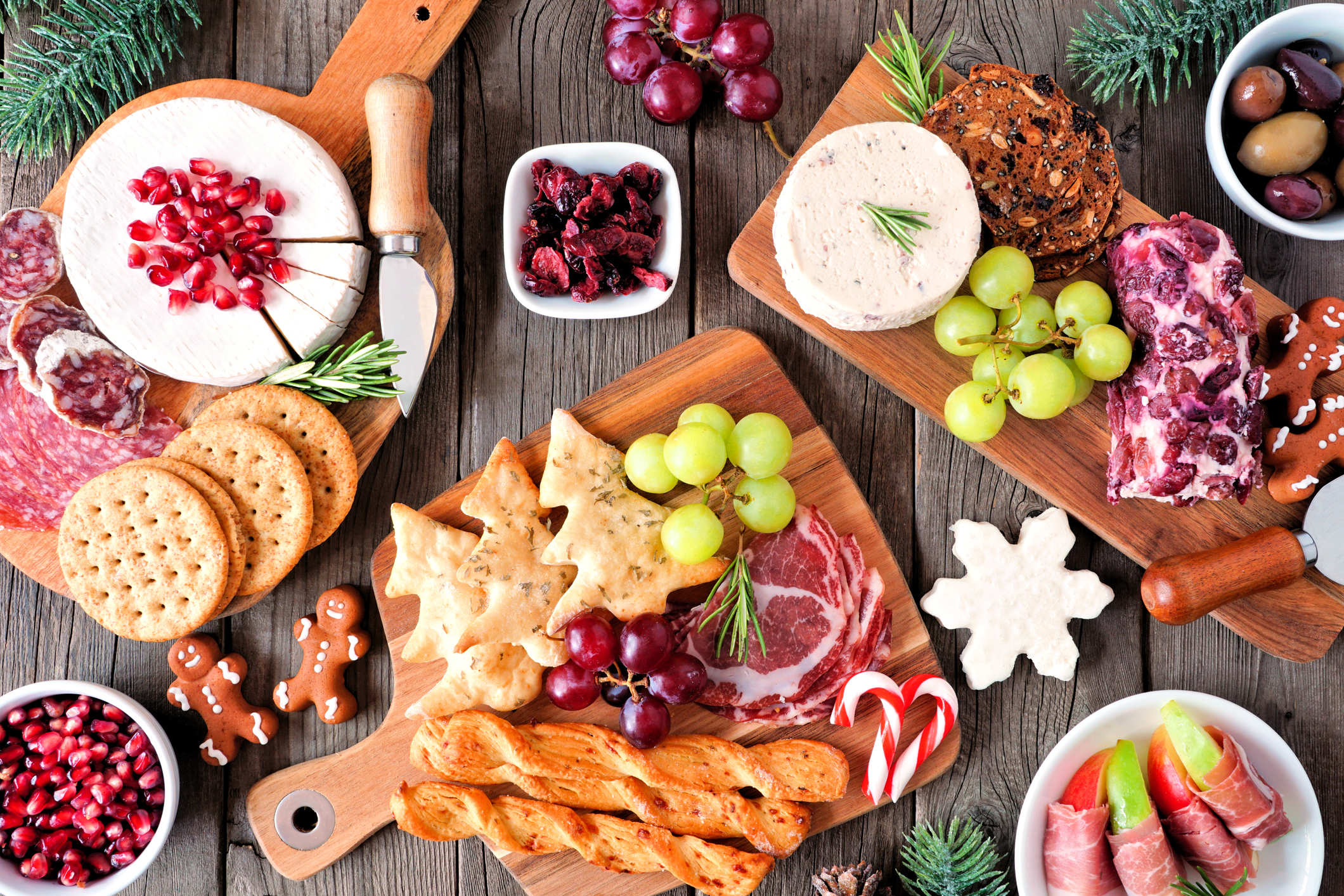 Christmas theme charcuterie top view table scene against dark wood